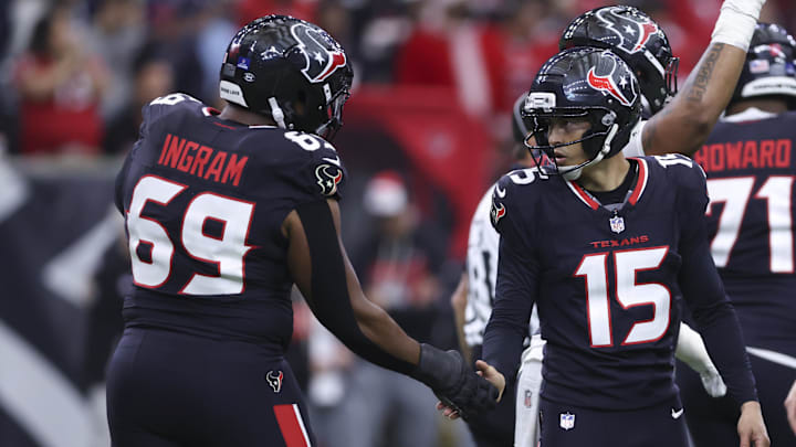 Dec 14, 2025; Houston, Texas, USA; Houston Texans place kicker Ka'Imi Fairbairn (15) celebrates with guard Ed Ingram (69) after kicking a field goal during the game against the Arizona Cardinals at NRG Stadium. Mandatory Credit: Troy Taormina-Imagn Images