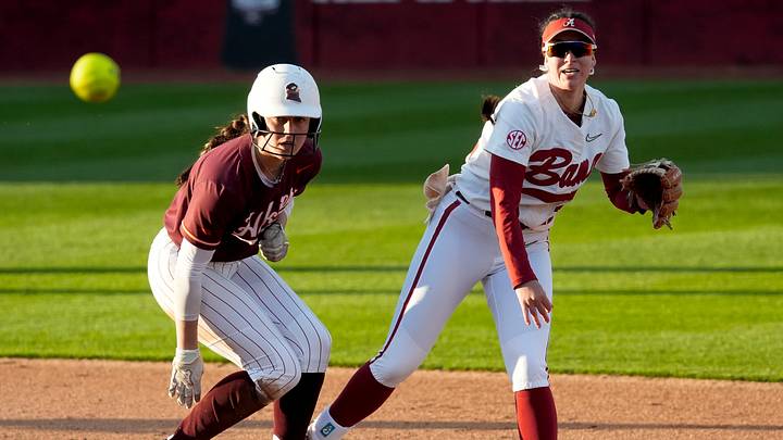 Feb 21, 2025; Tuscaloosa, Alabama, USA; Alabama second baseman Kali Heivilin attempts to turn a double play after forcing Virginiat Tech runner Bre Peck at second during the Easton Bama Bash at Rhoads Stadium Friday in the home opener for the Crimson Tide.
