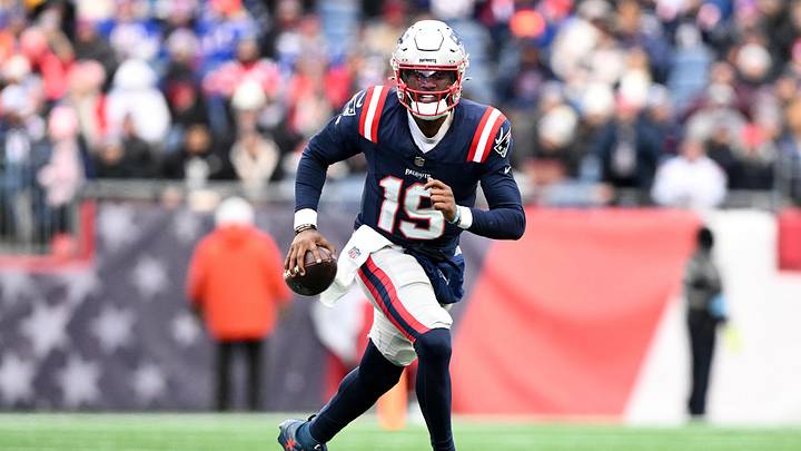 Jan 5, 2025; Foxborough, Massachusetts, USA; New England Patriots quarterback Joe Milton III (19) runs against the Buffalo Bills during the first half at Gillette Stadium. Mandatory Credit: Brian Fluharty-Imagn Images