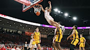 Nov 12, 2025; Houston, Texas, USA; Houston Cougars guard Kingston Flemings (4) dunks the ball during the first half against the Oakland Golden Grizzlies at Fertitta Center. 