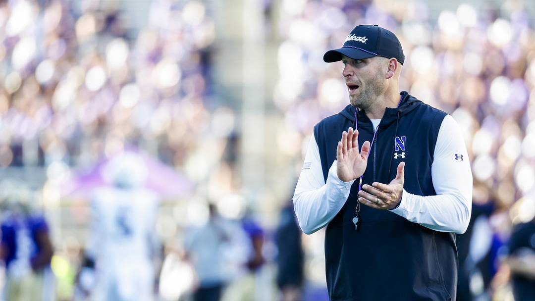 Sep 21, 2024; Seattle, Washington, USA; Northwestern Wildcats head coach David Braun watches pregame warmups against the Washington Huskies at Alaska Airlines Field at Husky Stadium. Mandatory Credit: Joe Nicholson-Imagn Images Sep 21, 2024; Seattle, Washington, USA; Northwestern Wildcats head coach David Braun watches pregame warmups against the Washington Huskies at Alaska Airlines Field at Husky Stadium. Mandatory Credit: Joe Nicholson-Imagn Images