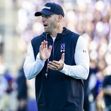 Sep 21, 2024; Seattle, Washington, USA; Northwestern Wildcats head coach David Braun watches pregame warmups against the Washington Huskies at Alaska Airlines Field at Husky Stadium. Mandatory Credit: Joe Nicholson-Imagn Images