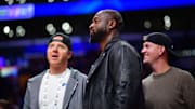 Nov 19, 2024; Los Angeles, California, USA; Utah Jazz minority owner Dwyane Wade with majority owner Ryan Smith (left) watch game action against the Los Angeles Lakers during the second half at Crypto.com Arena. Mandatory Credit: Gary A. Vasquez-Imagn Images