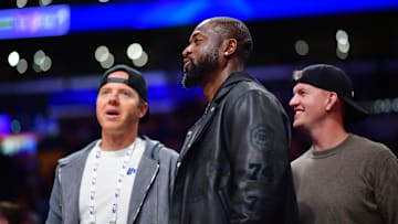 Nov 19, 2024; Los Angeles, California, USA; Utah Jazz minority owner Dwyane Wade with majority owner Ryan Smith (left) watch game action against the Los Angeles Lakers during the second half at Crypto.com Arena. Mandatory Credit: Gary A. Vasquez-Imagn Images