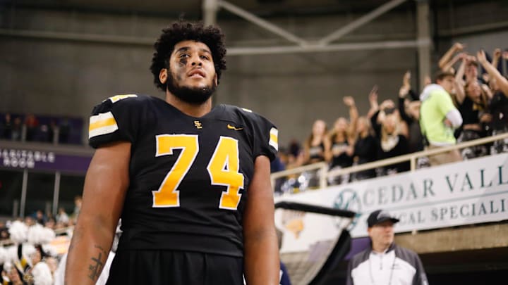 Southeast Polk lineman Kadyn Proctor (74) takes in the final seconds of the Class 5A playoff championships on Friday, Nov. 18, 2022, at the UNI-Dome in Cedar Falls. The Rams defeated the Tigers, 49-14.