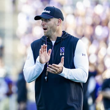 Sep 21, 2024; Seattle, Washington, USA; Northwestern Wildcats head coach David Braun watches pregame warmups against the Washington Huskies at Alaska Airlines Field at Husky Stadium. Mandatory Credit: Joe Nicholson-Imagn Images