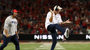 Sep 7, 2024; Tucson, Arizona, USA; Arizona Wildcats defensive line coach Joe Seumaloat and Arizona Wildcats defensive coordinator Duane Akina celebrates a tackle against Northern Arizona Lumberjacks during the fourth quarter Arizona Stadium. Mandatory Credit: Aryanna Frank-Imagn Images