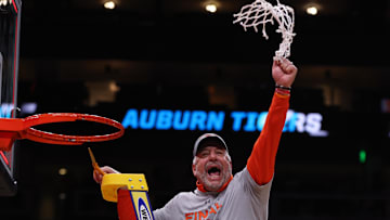 Mar 30, 2025; Atlanta, GA, USA; Auburn Tigers head coach Bruce Pearl cuts down the net after winning the South Regional final of the 2025 NCAA tournament against the Michigan State Spartans at State Farm Arena. Mandatory Credit: Brett Davis-Imagn Images
