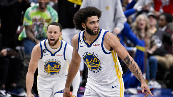 Mar 22, 2023; Dallas, Texas, USA; Golden State Warriors guard Stephen Curry (30) and forward Anthony Lamb (40) celebrate during the second half against the Dallas Mavericks at the American Airlines Center. Mandatory Credit: Jerome Miron-USA TODAY Sports