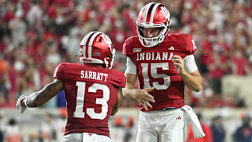 Sep 20, 2025; Bloomington, Indiana, USA; Indiana Hoosiers wide receiver Elijah Sarratt (13) and IIndiana Hoosiers quarterback Fernando Mendoza (15) celebrate after a touchdown during the second half against the Illinois Fighting Illini at Memorial Stadium. Mandatory Credit: Robert Goddin-Imagn Images
