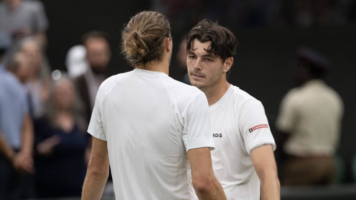 Jul 8, 2024; London,United Kingdom; Taylor Fritz of the United States (right) greets at the net with Alexander Zverev of Germany (left) after their match on day eight of The Championships at All England Lawn Tennis and Croquet Club. 