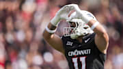 Sep 13, 2025; Cincinnati, Ohio, USA;  Cincinnati Bearcats tight end Joe Royer (11) celebrates scoring a touchdown against the Northwestern State Demons in the first half at Nippert Stadium. Mandatory Credit: Aaron Doster-Imagn Images