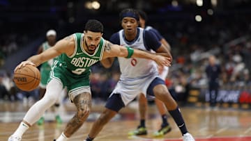 Dec 15, 2024; Washington, District of Columbia, USA; Boston Celtics forward Jayson Tatum (0) dribbles the ball as Washington Wizards guard Bilal Coulibaly (0) defends in the second quarter at Capital One Arena. Mandatory Credit: Geoff Burke-Imagn Images