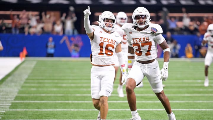 Jan 1, 2024; New Orleans, LA, USA; Texas Longhorns wide receiver Bryce Chambers (37) celebrates with defensive back Michael Taaffe (16) after recovering a fumble during the second quarter against the Washington Huskies in the 2024 Sugar Bowl college football playoff semifinal game at Caesars Superdome. Mandatory Credit: Matthew Hinton-USA TODAY Sports