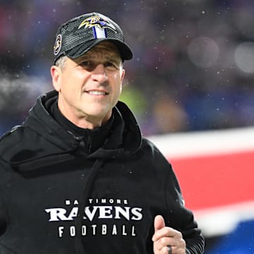 Baltimore Ravens head coach John Harbaugh takes the field before the game against the Buffalo Bills.