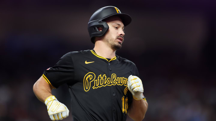 Jun 28, 2024; Atlanta, Georgia, USA; Pittsburgh Pirates left fielder Bryan Reynolds (10) hits a single against the Atlanta Braves in the eighth inning at Truist Park. Mandatory Credit: Brett Davis-USA TODAY Sports