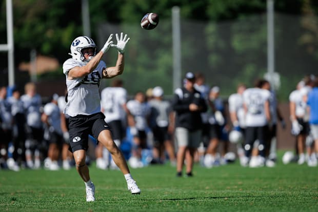BYU wide receiver Cody Hagen (18) catches a pass at Fall camp