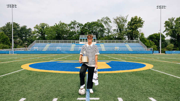 Loyola Blakefield's Dan Klink poses at midfield with the 2024-2025 Gatorade National Boys Soccer Player of the Year award.
