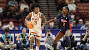 Mar 7, 2025; Greenville, SC, USA; Texas Longhorns guard Rori Harmon (3) handles the ball defended by Ole Miss Rebels guard Sira Thienou (0) during the first half at Bon Secours Wellness Arena. Mandatory Credit: Jim Dedmon-Imagn Images