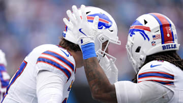 Buffalo Bills running back James Cook III (4) celebrates with quarterback Josh Allen (17) after scoring a touchdown during the second half against the Carolina Panthers at Bank of America Stadium.