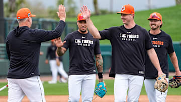 From left, Detroit Tigers manager A.J. Hinch high-fivesshortstop Javier Báez, infielder Trey Sweeney and infielder Zach McKinstry after a workout during spring training at Joker Marchant Stadium in Lakeland, Fla. on Thursday, Feb. 20, 2025.