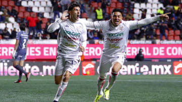 José Paradela (left) and Ricardo Monreal celebrate after the former scored Necaxa's equalizer against Tijuana Friday night. Paradela  added the winner to help the Rayos remain in the Liga MX playoff hunt.