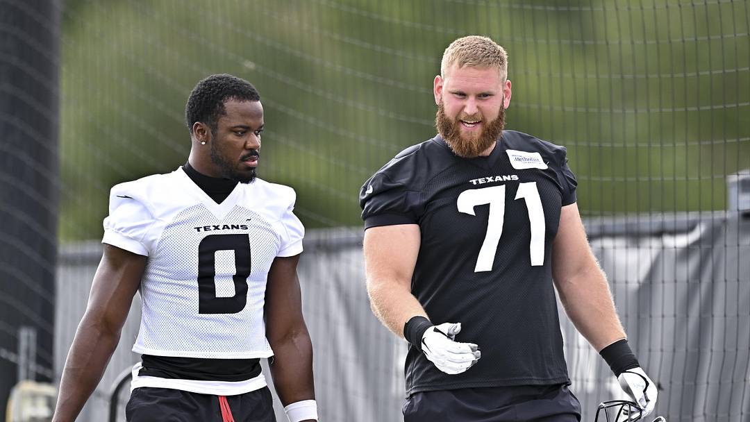 Jun 9, 2026; Houston, Texas, USA; Houston Texans linebacker Azeez al-Shaair, left, and offensive tackle Braden Smith, right, arrive for the team’s minicamp at Houston Methodist Training Center. Mandatory Credit: Maria Lysaker-Imagn Images  