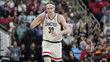 Mar 21, 2025; Raleigh, NC, USA; Connecticut Huskies forward Liam McNeeley (30) reacts during the first half against the Oklahoma Sooners at Lenovo Center. Mandatory Credit: Bob Donnan-Imagn Images
