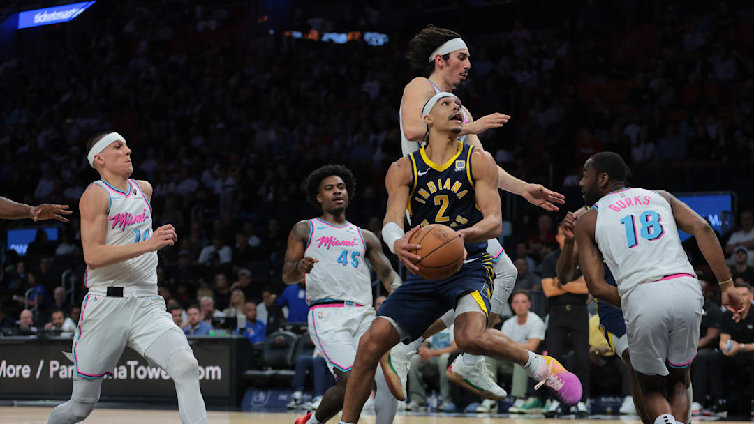 Feb 28, 2025; Miami, Florida, USA; Indiana Pacers guard Andrew Nembhard (2) drives to the basket against Miami Heat guard Jaime Jaquez Jr. (11) during the second quarter at Kaseya Center. Mandatory Credit: Sam Navarro-Imagn Images