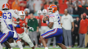 Sep 20, 2025; Miami Gardens, Florida, USA; Florida Gators quarterback DJ Lagway (2) looks for a passing option against the Miami Hurricanes during the first quarter at Hard Rock Stadium. Mandatory Credit: Sam Navarro-Imagn Images