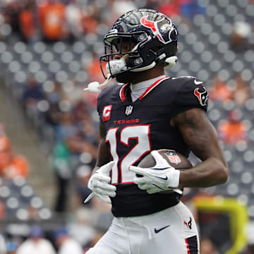 Nov 2, 2025; Houston, Texas, USA; Houston Texans wide receiver Nico Collins (12) warms up before a game against the Denver Broncos at NRG Stadium. Mandatory Credit: Thomas Shea-Imagn Images