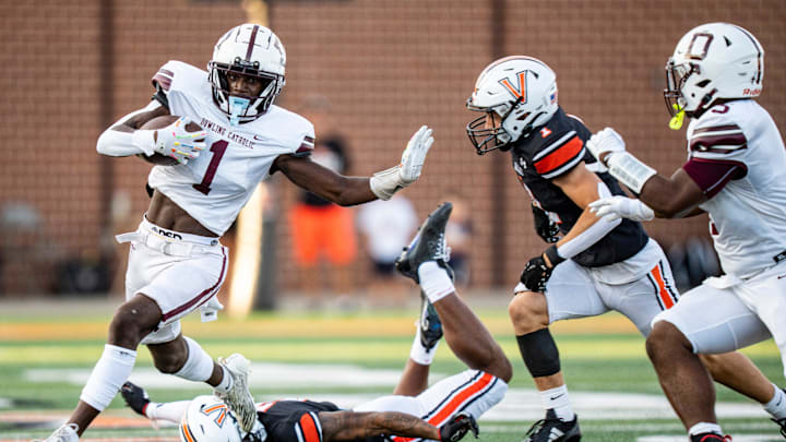 Dowling Catholic wide receiver Sam Drexler (1) carries the ball during a high school football game between Valley and Dowling Catholic on Aug. 29, 2025, at Valley Stadium in West Des Moines, Iowa.