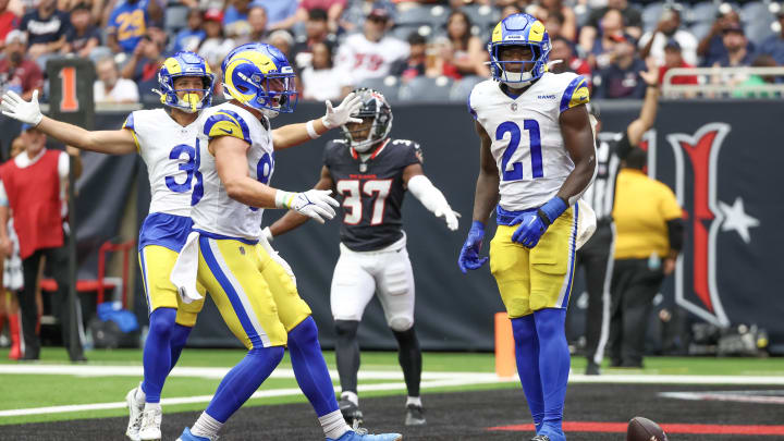 Aug 24, 2024; Houston, Texas, USA; Los Angeles Rams running back Zach Evans (21) celebrates his touchdown against the Houston Texans in the second quarter at NRG Stadium. Mandatory Credit: Thomas Shea-USA TODAY Sports