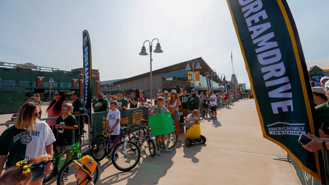 Children gather with their bicycles before the Dream Drive at the first day of Packers training camp on Monday.