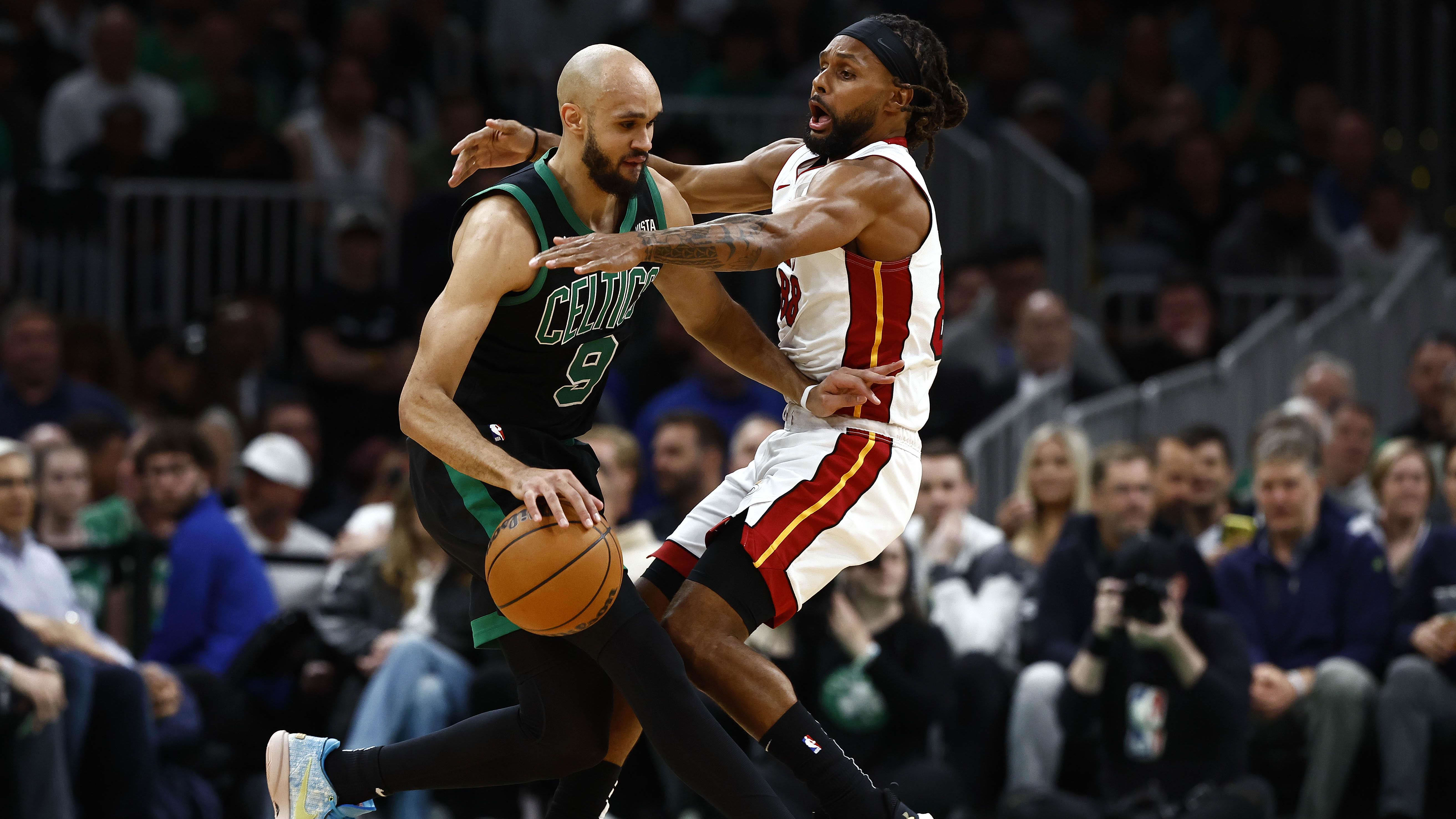 Heat guard Patty Mills tries to slow down White with little success.