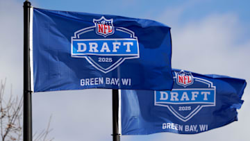 Flags promoting the 2025 NFL Draft pictured on April 19, 2025, at Leicht Memorial Park in Green Bay, Wis.