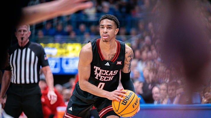Mar 1, 2025; Lawrence, Kansas, USA; Texas Tech Red Raiders guard Chance McMillian (0) brings the ball up court during the first half against the Kansas Jayhawks at Allen Fieldhouse. Mandatory Credit: William Purnell-Imagn Images