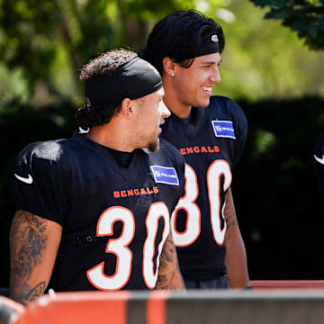 Cincinnati Bengals running back Chase Brown (30), wide receiver Andrei Iosivas (80) and wide receiver Charlie Jones (15) walk to the practice field, Thursday, Sept. 5, 2024, at Paycor Stadium in Cincinnati.