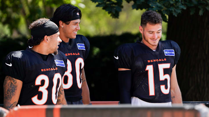 Cincinnati Bengals running back Chase Brown (30), wide receiver Andrei Iosivas (80) and wide receiver Charlie Jones (15) walk to the practice field, Thursday, Sept. 5, 2024, at Paycor Stadium in Cincinnati.