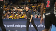 Feb 19, 2025; Morgantown, West Virginia, USA; Cincinnati Bearcats head coach Wes Miller calls out a play during the first half against the West Virginia Mountaineers at WVU Coliseum. Mandatory Credit: Ben Queen-Imagn Images