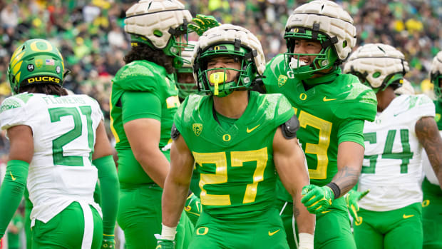 Oregon Green Team running back Jayden Limar celebrates a touchdown during the Oregon Ducks’ Spring Game