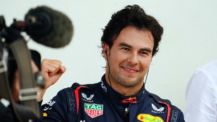 May 6, 2023; Miami Gardens, Florida, USA;  Red Bull driver Sergio Perez (11) of Mexico races after climbing from his car setting the pole position during qualifying for the Miami Grand Prix at Miami International Autodrome. Mandatory Credit: John David Mercer-USA TODAY Sports