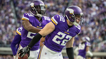 Oct 15, 2017; Minneapolis, MN, USA; Minnesota Vikings safety Harrison Smith (22) celebrates with cornerback Xavier Rhodes (29) after his interception during the fourth quarter against Green Bay Packers at U.S. Bank Stadium.