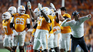 Oct 19, 2024; Knoxville, Tennessee, USA; Tennessee Volunteers players and coaches react after a play under review was ruled a touchdown against the Alabama Crimson Tide in the fourth quarter at Neyland Stadium. Mandatory Credit: Alan Poizner-Imagn Images