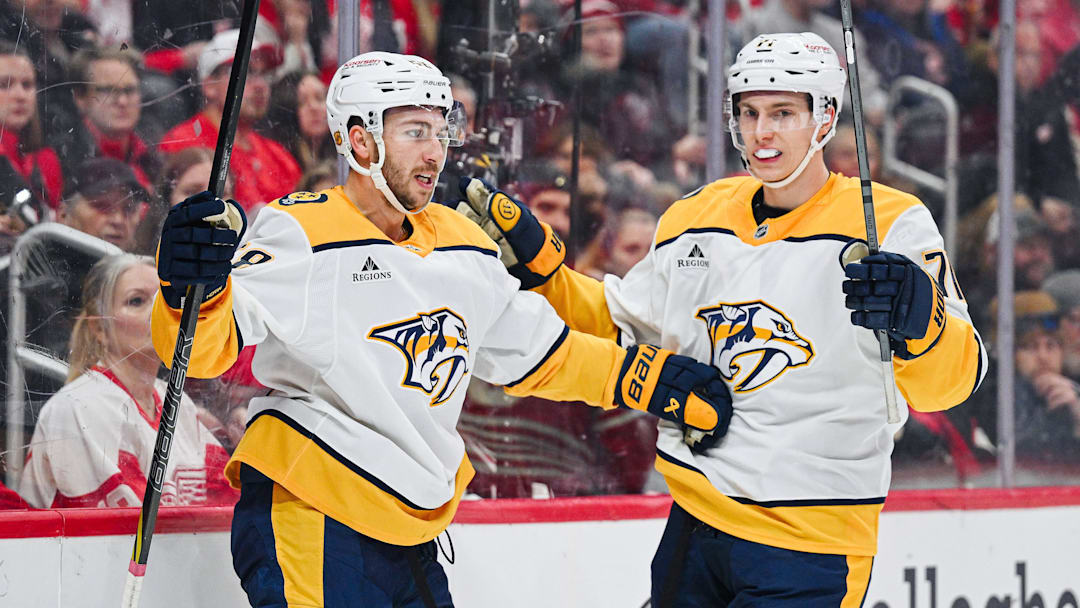 Nov 26, 2025; Detroit, Michigan, USA; Nashville Predators left wing Michael Bunting (58) celebrates his goal with right wing Matthew Wood (71) during the first period against the Detroit Red Wings at Little Caesars Arena. Mandatory Credit: Tim Fuller-Imagn Images Nov 26, 2025; Detroit, Michigan, USA; Nashville Predators left wing Michael Bunting (58) celebrates his goal with right wing Matthew Wood (71) during the first period against the Detroit Red Wings at Little Caesars Arena. Mandatory Credit: Tim Fuller-Imagn Images