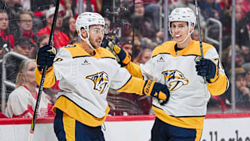 Nov 26, 2025; Detroit, Michigan, USA; Nashville Predators left wing Michael Bunting (58) celebrates his goal with right wing Matthew Wood (71) during the first period against the Detroit Red Wings at Little Caesars Arena. Mandatory Credit: Tim Fuller-Imagn Images