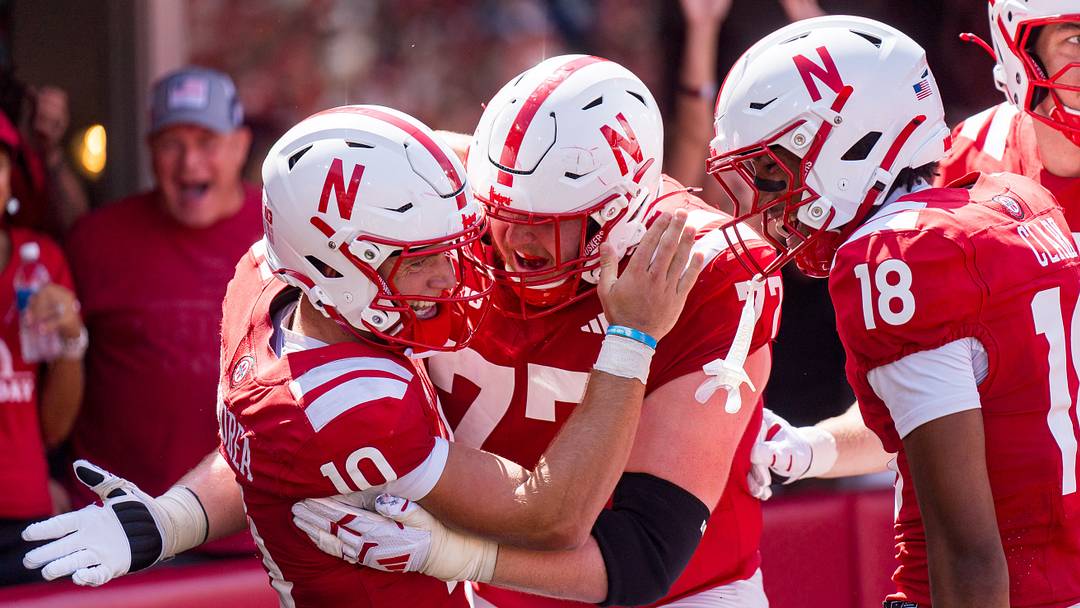 Nebraska quarterback Anthony Colandrea (10) celebrates with offensive lineman Tyler Knaak, wide receiver Quinn Clark (18) after a touchdown in the third quarter against Ohio. Nebraska quarterback Anthony Colandrea (10) celebrates with offensive lineman Tyler Knaak, wide receiver Quinn Clark (18) after a touchdown in the third quarter against Ohio.