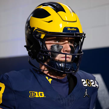 Jan 8, 2024; Houston, TX, USA; Michigan Wolverines quarterback Jack Tuttle (13) against the Washington Huskies during the 2024 College Football Playoff national championship game at NRG Stadium. Mandatory Credit: Mark J. Rebilas-Imagn Images