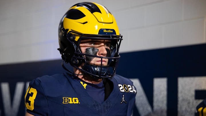 Jan 8, 2024; Houston, TX, USA; Michigan Wolverines quarterback Jack Tuttle (13) against the Washington Huskies during the 2024 College Football Playoff national championship game at NRG Stadium. Mandatory Credit: Mark J. Rebilas-Imagn Images