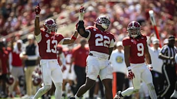 Oct 12, 2024; Tuscaloosa, Alabama, USA; Alabama Crimson Tide defensive back Malachi Moore (13), lineman LT Overton (22), and defensive back Jaylen Mbakwe (9) react to recovering a fumble by the South Carolina Gamecocks during the fourth quarter at Bryant-Denny Stadium. Mandatory Credit: Will McLelland-Imagn Images